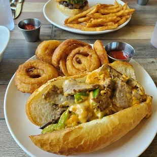 Tritium cheese Philly and onion rings.