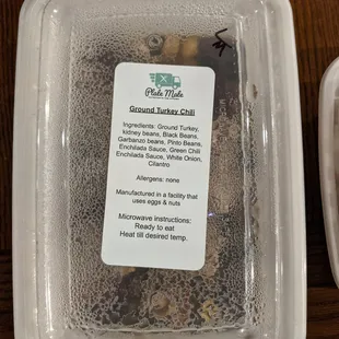 a container of groundnuts and a container of groundnuts