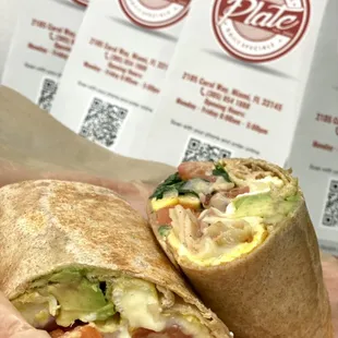 Customer special request ! Breakfast wrap on steroids ! ( Eggs, turkey, avocado, tomatoes, onions, spinach and Swiss cheese)