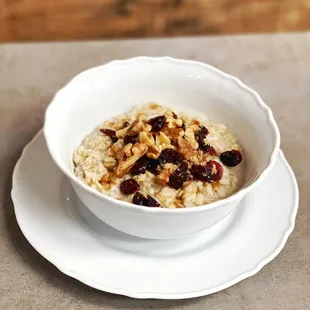 Oat meal ! Served with cranberries and walnuts !