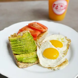 Special ! Fresh Avocado And tomato Toast with sunny side up eggs !