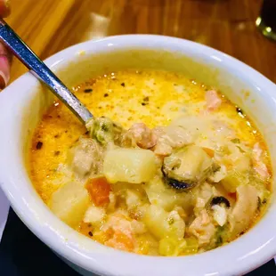 Seafood chowder with lots of seafood and potatoes.