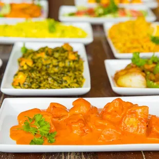 a variety of indian food dishes