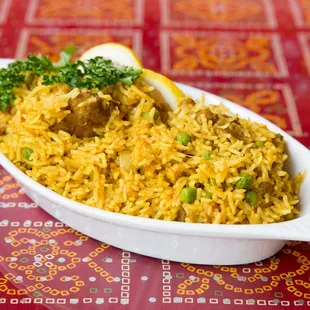 a dish of rice with meat and vegetables