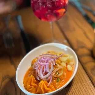 Peruvian ceviche in leche de tigre and red sangria.