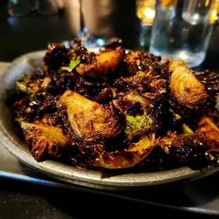 a bowl of fried vegetables on a tray