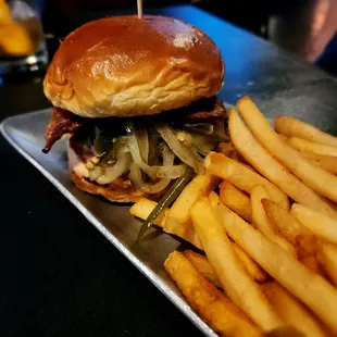 a burger and french fries on a tray