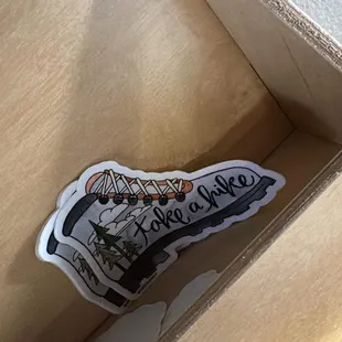 a cup of coffee in a cardboard box