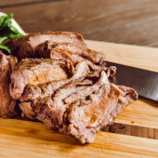sliced meat on a cutting board