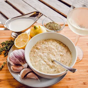 a bowl of oatmeal with garlic, lemons, and garlic