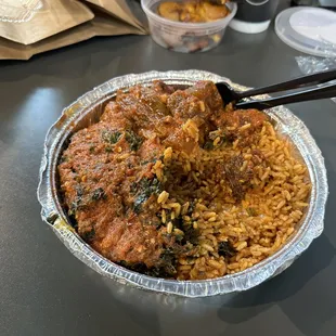 Cow, spinach, and jollof rice