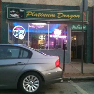 a car parked in front of a restaurant