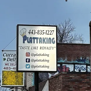 a sign for plattaking on a street corner
