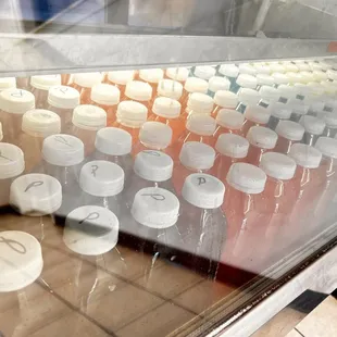 a variety of bottles in a display case