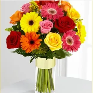 "The Pick-Me-Up™ Bouquet by FTD® - VASE INCLUDED".  This is what my mom SHOULD HAVE received.  You be the judge.