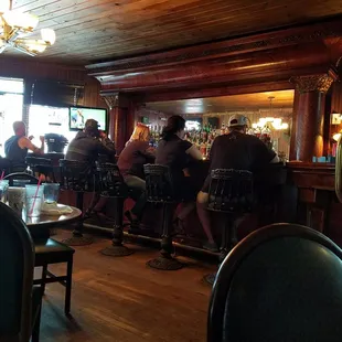 people sitting at the bar