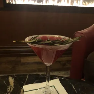 Raspberry drink with a rosemary sprig. Delish!!
