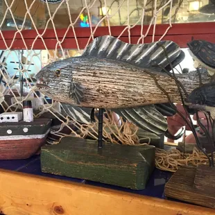 a display of a fish on a shelf