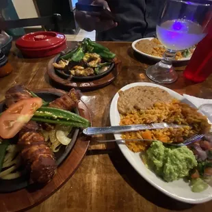 Fajitas, bacon wrapped chicken, beans, rice &amp; guac