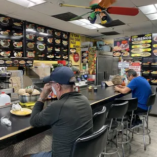 a man sitting at the counter