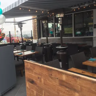 People watch from the best patio on the pier