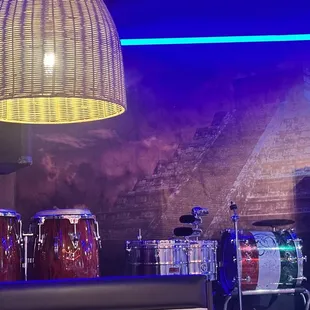 a drum set up in a music studio