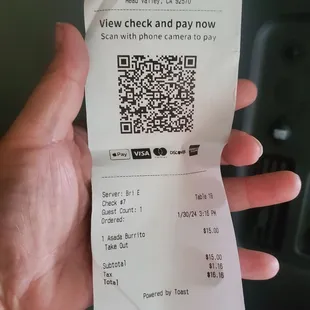a person holding a check and pay now