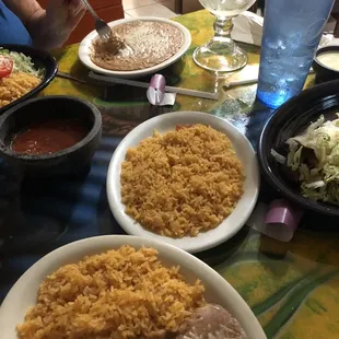 the spread, with a side of rice and a side of beans shown