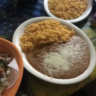 side of rice and beans that came with tacos
