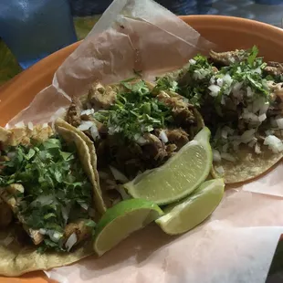 three tacos, one fish (on left) and two pork (on right)