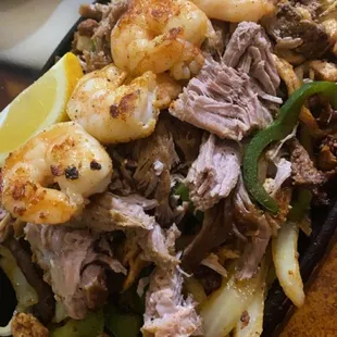 Fajitas, with shrimp, chorizo, steak , chicken and carnitas.