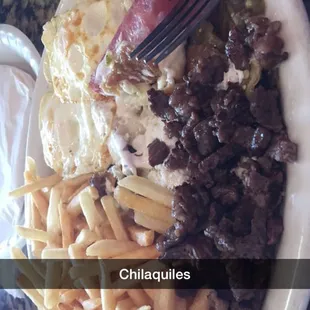Chilaquiles didn't want beans and rice so ordered French fries mmmm huge portions for a great price
