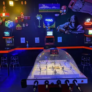 a game room with neon lights