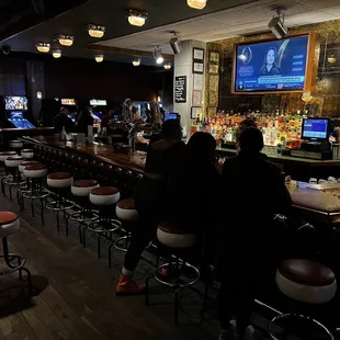 people sitting at the bar