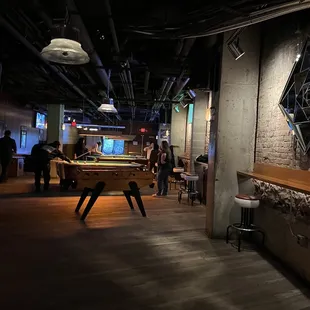 a pool table in the middle of the room