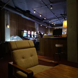 people playing video games at the bar