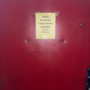 a red door with a sign on it