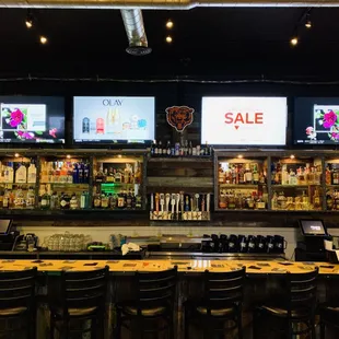 a bar with multiple televisions