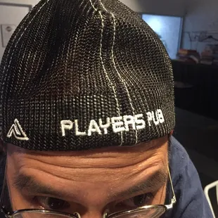 a man with glasses and a beanie