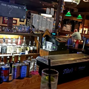 a bar filled with bottles of alcohol