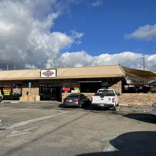 cars parked in front of the restaurant