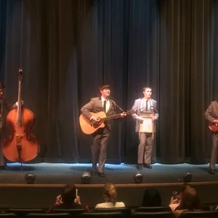 Surprise jam session while waiting for the show! Yes, that guy is playing a washboard with a desk bell!