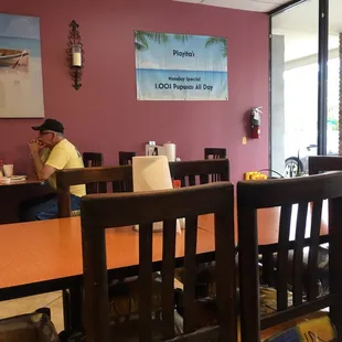 a man sitting at a table in a restaurant