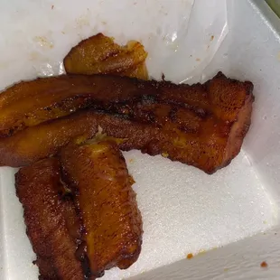 a close up of some food in a styrofoam container