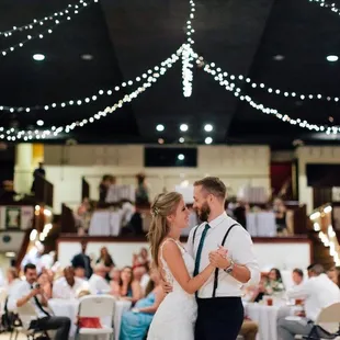 a bride and groom sharing a first dance