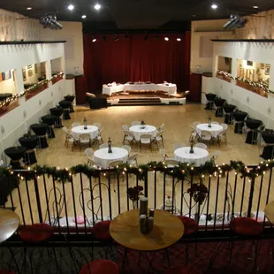 tables, chairs, and a stage