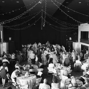 a black and white photo of a banquet hall