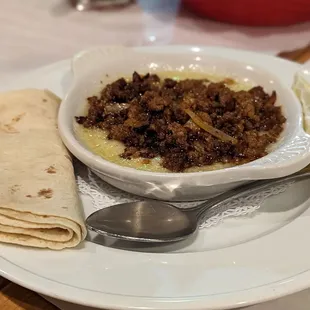 a bowl of ground beef and tortilla
