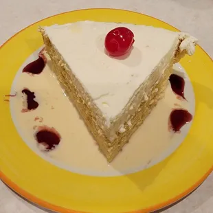 a slice of cake on a yellow plate
