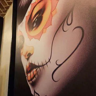 a woman's face with a sun on it